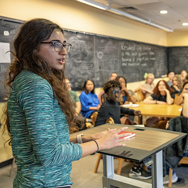 Concourse student Angelina (Angie) Ayoubi gives a speech during a student debate.